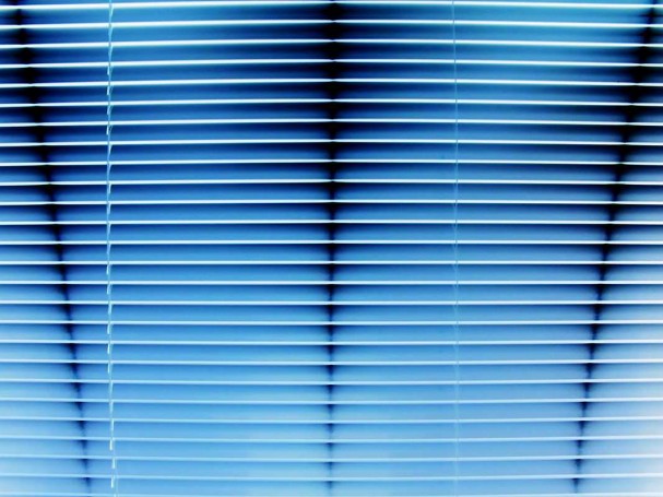 A picture of a blue background with blinds Cardiff over the top
