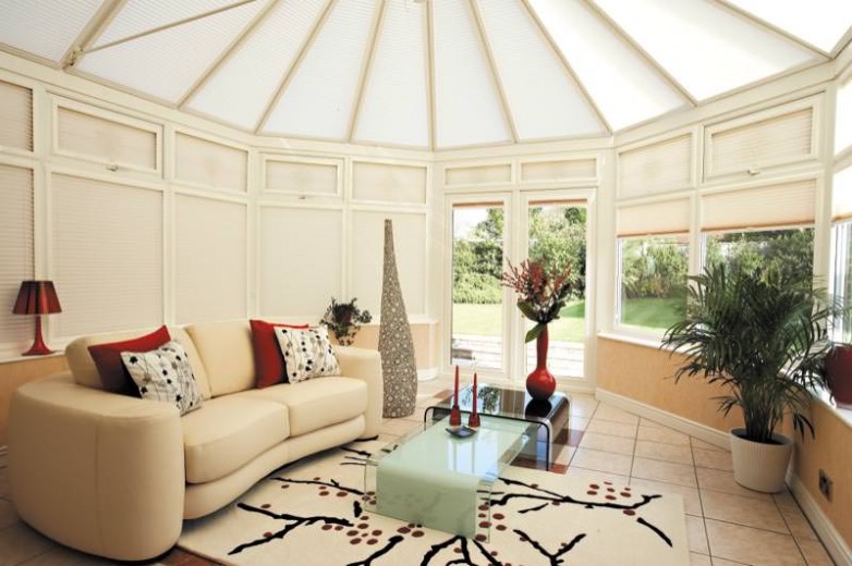 Pleated blinds cardiff i every window of a conservatory with some open and some closed to show the functionality