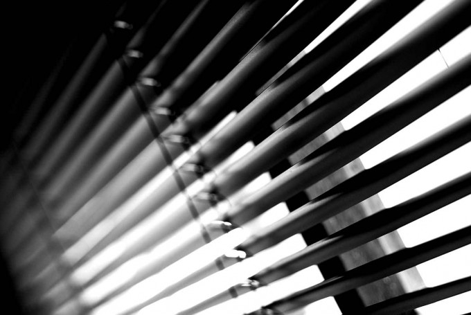 A closeup image of some black coloured blinds