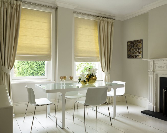 A picture of a dining room with cream coloured blinds Cardiff