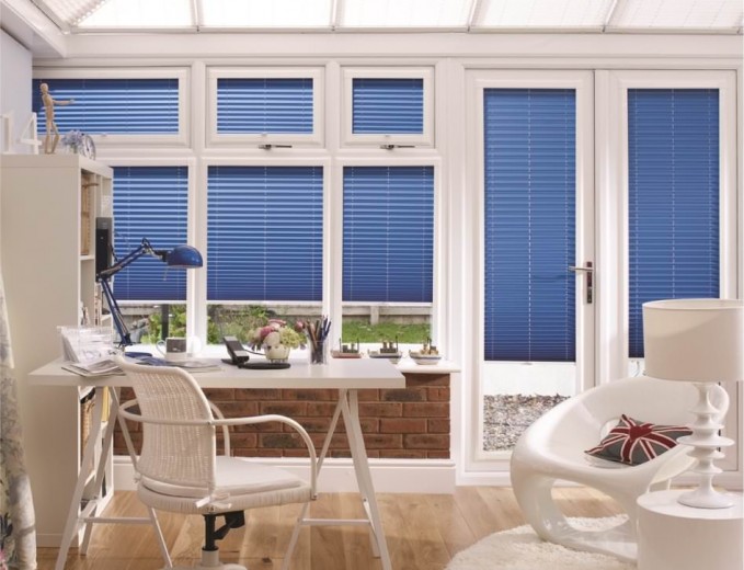 A photograph of a conservatory with blue blinds cardiff