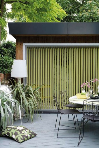 A picture of what seems to be an outside area with green blinds Cardiff