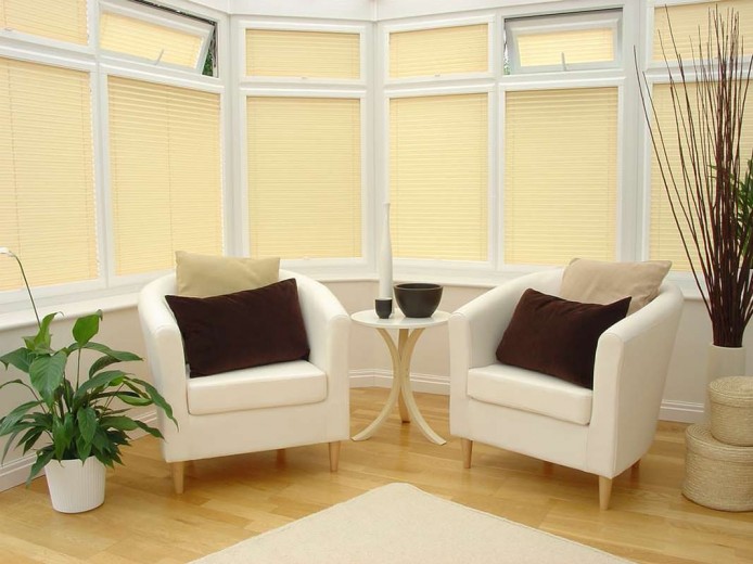 An image of a conservatory with cream blinds Cardiff